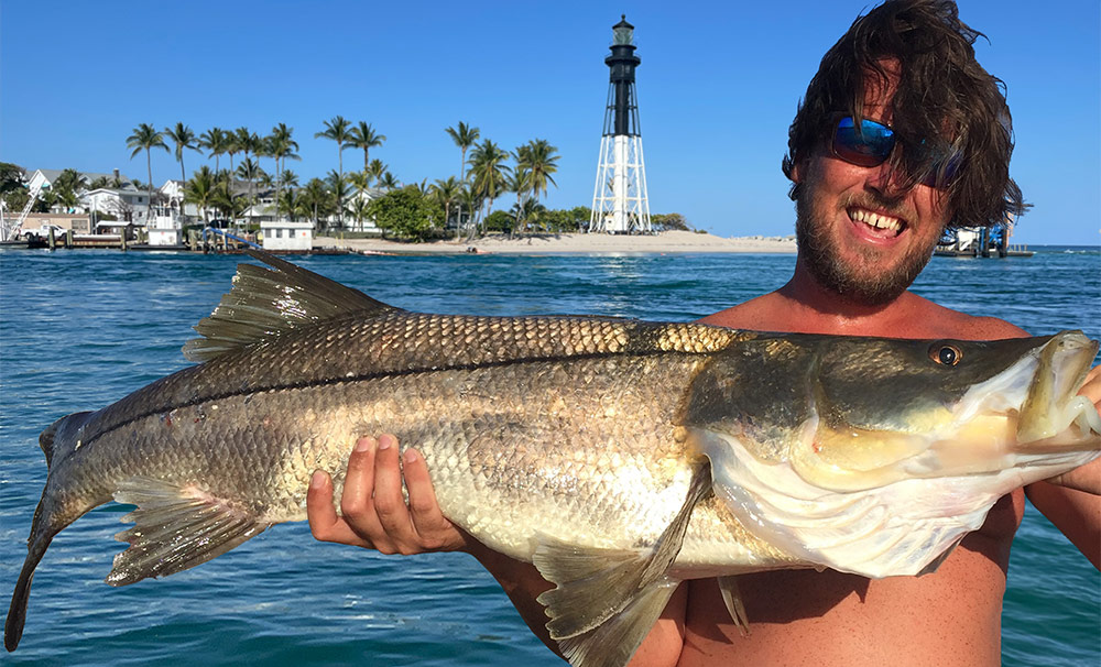 Man holding a large fish on an inshore fishing charter